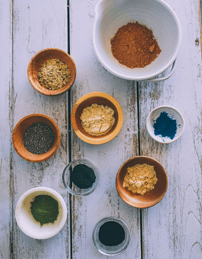 Bowls of various sizes with herbs and spices used in food and beverages at Organic Tree in Dana Point